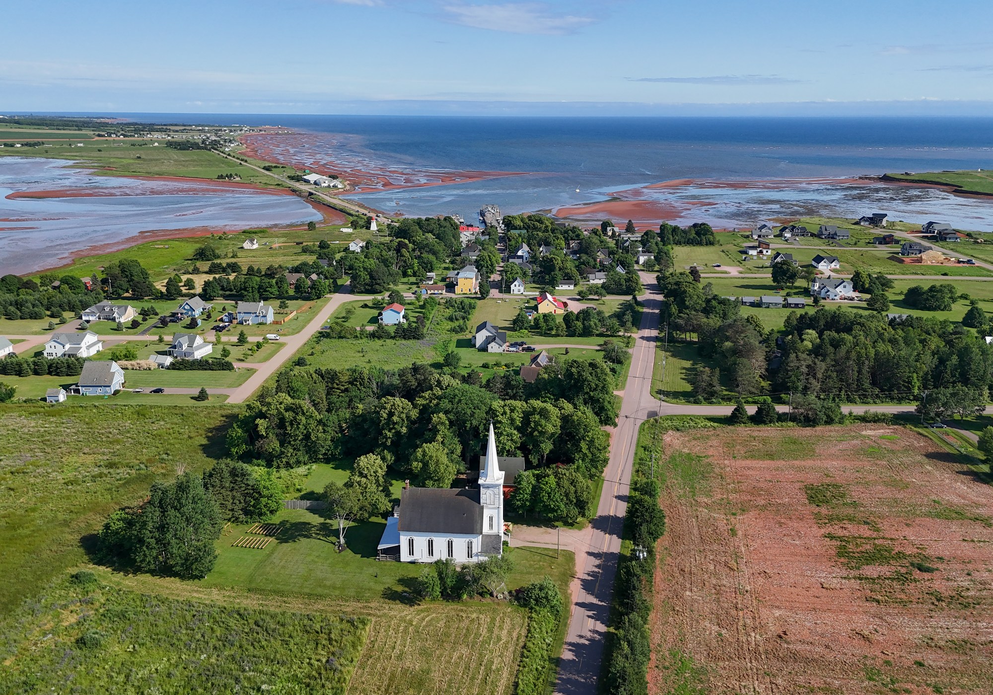 Aerial view of Victoria, Prince Edward Island, with its church, streets and harbour